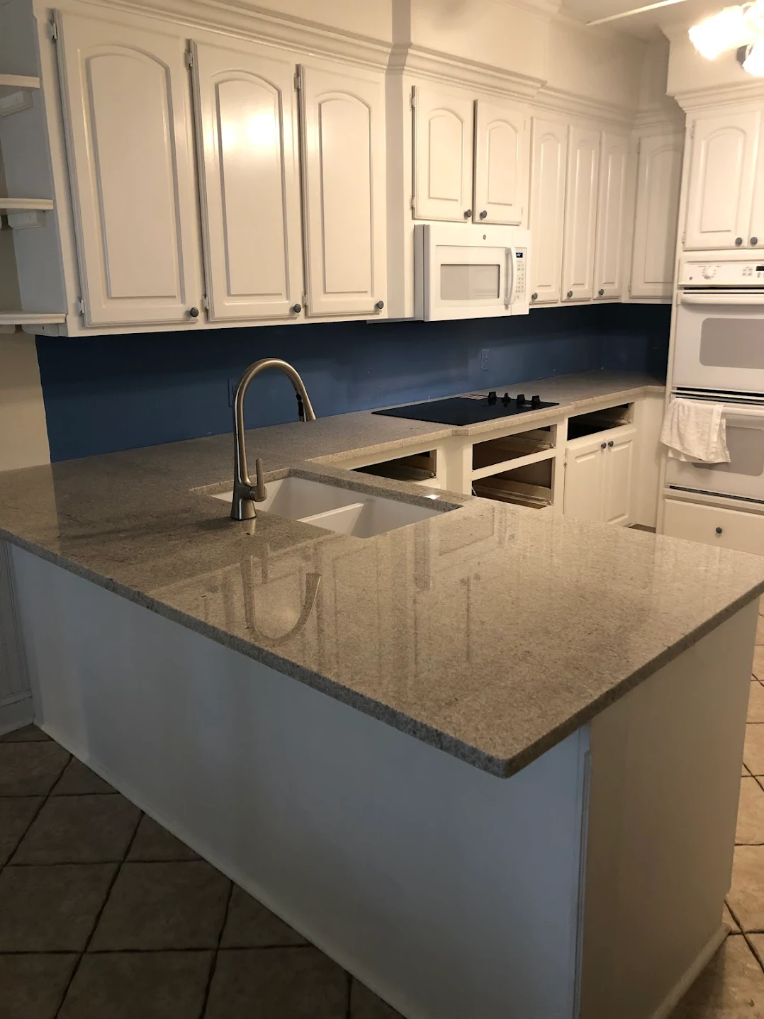 Forest Acres kitchen in Itanus White granite